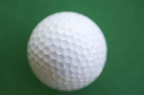 Free Stock Image Of White Golf Ball With Dimple Pattern On Green