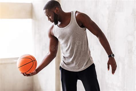 Confident Athletic Man With Beard Performing Exercises With Ball Stock
