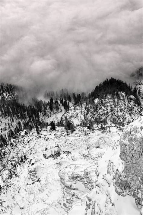 Grayscale Photography Of Snow Covered Mountain · Free Stock Photo