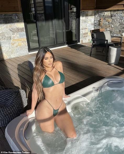kim kardashian wows in tiny green string bikini in hot tub as she shares snaps from her recent