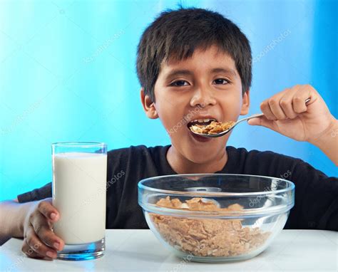 Boy Eating Cereal — Stock Photo © Dimarik 118293834