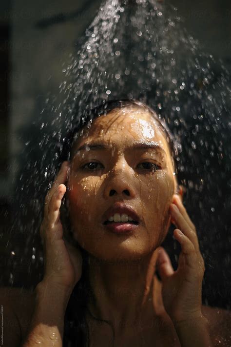 Woman Taking Shower By Stocksy Contributor Marko Stocksy