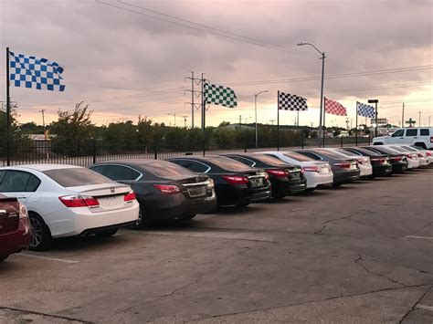 An arrow pointing up and to the right. AUTO HAUS IMPORTS - AUTOMOTIVE CARS AUTO SALES AND RENTALS