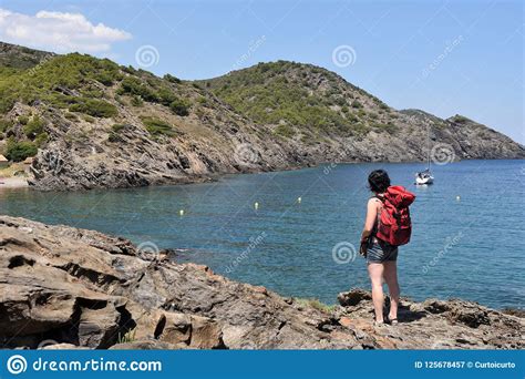 Woman In The Cap De Creus On The La Taballera Beach Costa Stock Image Image Of Backpack