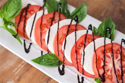 Toss the small ones in whole. Caprese Salad with Fresh Tomatoes + Mozzarella | Lil' Luna