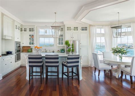 Not only the lacquered blue in the bar chairs, island, and the refrigerator, but the blue led lamps installed behind the cabinetry tell you perfectly. Beach House with Airy Coastal Interiors - Home Bunch ...