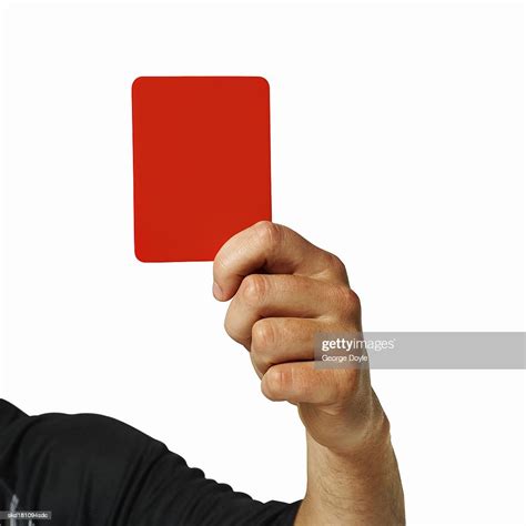 Close Up Of A Referee Holding Up A Red Card High Res Stock Photo