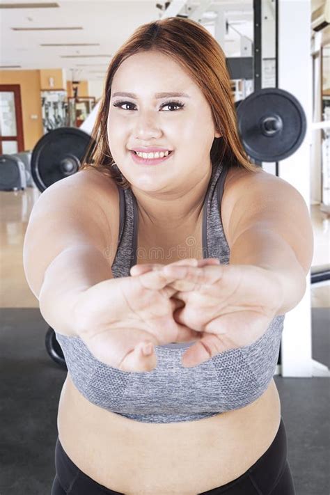 Obese Woman Stretching In The Gym Center Stock Photo Image Of Looking