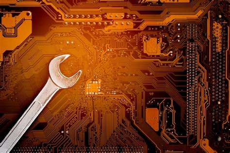 Premium Photo Wrench On Computer Circuit Boardmaintenance And