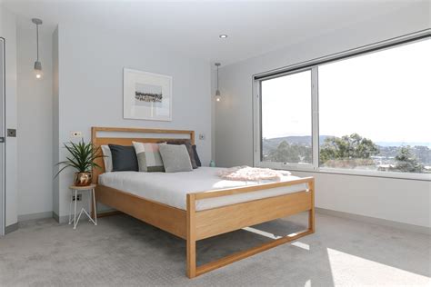 Our curated collection of modern beds offers all the comfort, style and function you dream of. Modern contemporary winter Scandinavian bedroom timber bed frame faux fur pink grey white ch ...