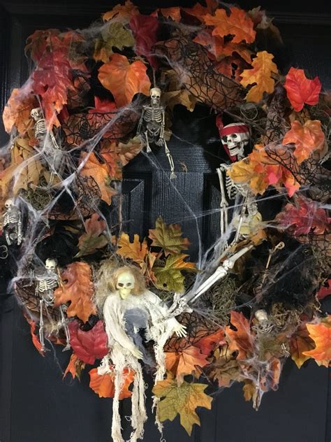 Spooky Skeleton Wreath On Grapevine With Fall Foliage And Spider Web