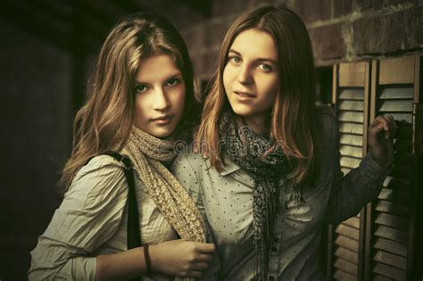 Two Young Fashion Girls Next To Brick Wall Stock Image Image Of Casual Face 91120773