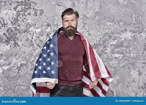 american hipster man celebrate independence day with national flag cultural identity concept