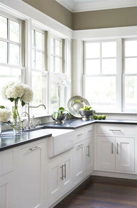 Our farmhouse sink collections are designed to a specific standard to compliment your home and meet personal style. white farmhouse sink with white custom cabinets and black ...