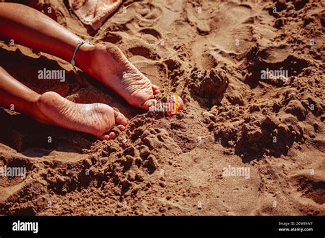 Womans Feet In Clear Water On Beach Stock Photo Alamy