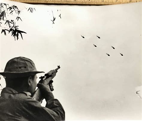 X Photograph Of Viet Cong Shooting At Huey Helicopters Enemy