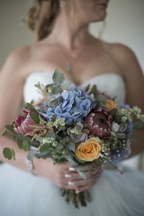 We are providing best south africa flowers with the help of our expert florists who are always ready for your any kind of flowers delivery needs. Bridal bouquet with South African Proteas in 2020 | Brides ...