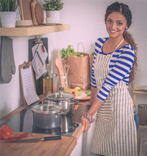 Beautiful Woman Standing In Kitchen With Apron Stock Photo Image Of
