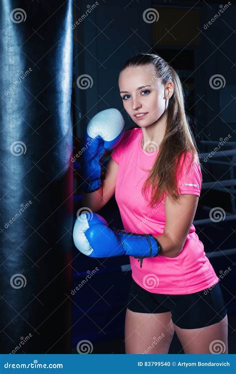 Attractive Young Woman With Blue Boxing Gloves In Sport Gym Beautiful