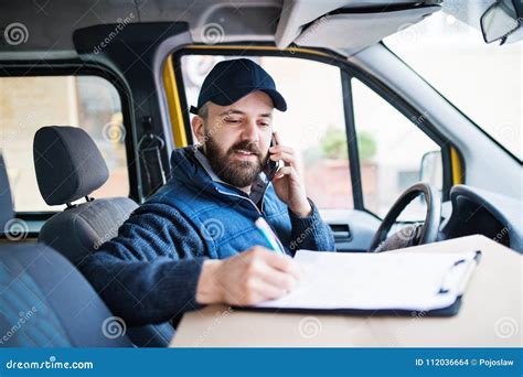 Delivery Man Delivering Parcel Box To Recipient Stock Photo Image Of
