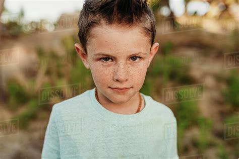Serious Portrait Of Kindergarten Aged Boy Staring Seriously Stock