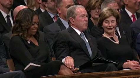 George W Bush Appears To Hand Michelle Obama Something At Fathers Funeral Recreating Viral