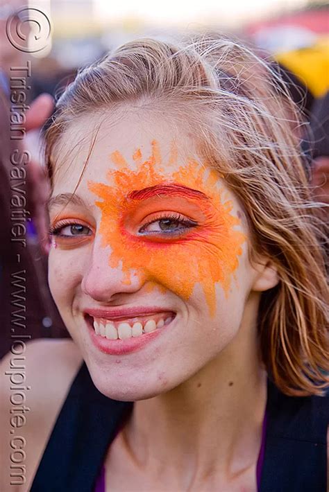 Woman With Orange Face Paint Sun Eye
