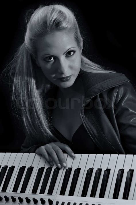 Sexy Lady In Bra And Leather Coat Posing With Synthesizer Black And White Stock Image Colourbox