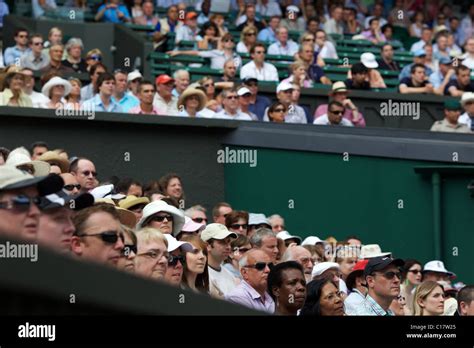 Spectators Watch The Tennis At The All England Lawn Tennis