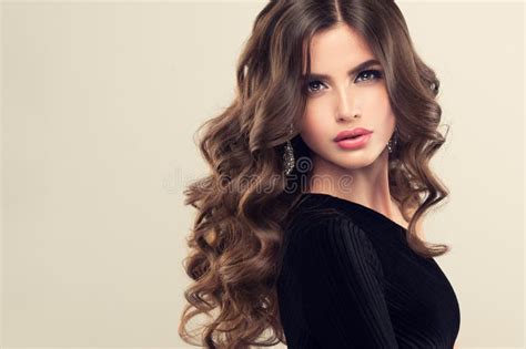 Brown Haired Woman With Voluminous Shiny And Curly Hairstyle Frizzy