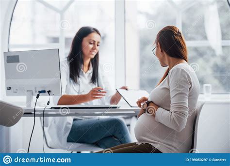 Active Conversation Pregnant Woman Have Consultation With Obstetrician Indoors Stock Image
