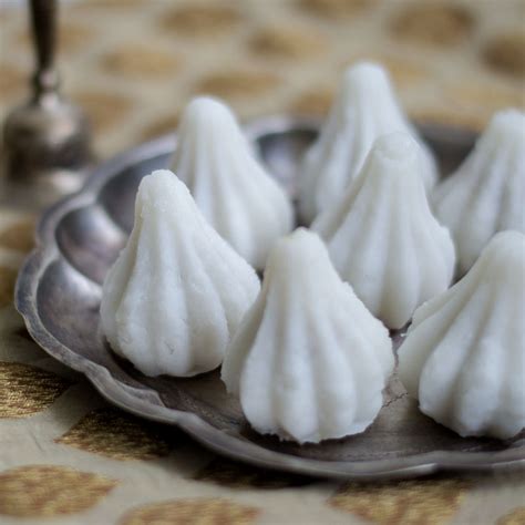 The thick white cream will rise to the surface of the liquid leaving the clear watery milk below. Mothagam - Sweet Coconut Kozhukattai for Vinayagar Chathurthi