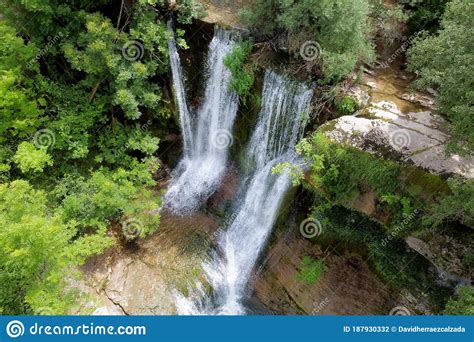 Aerial View Of An Idyllic Rain Forest Waterfall Stream Flowing In The