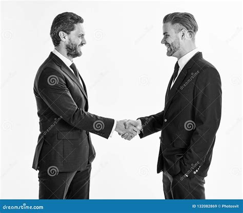 Men In Suits Or Businessmen Hold Hands In Handshake Stock Image