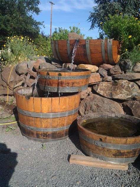 Place the wine barrel on top of the reservoir then fill it with water and plug in the pump into the electrical housing. Triple Trough Fountain $575.00 | Barrel fountain, Garden ...