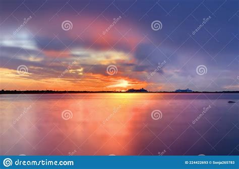 Sunbeam On Dramatic Sunset Orange Gold Lilac Clouds On Dark Sky Sunbeam