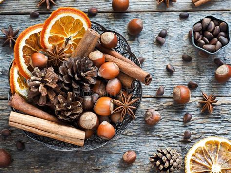 Winter Ingredients Nuts Cones Oranges Cinnamon Star Anise In A Bowl