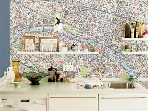 A Kitchen With A Map On The Wall Next To A Dish Washer And Dryer