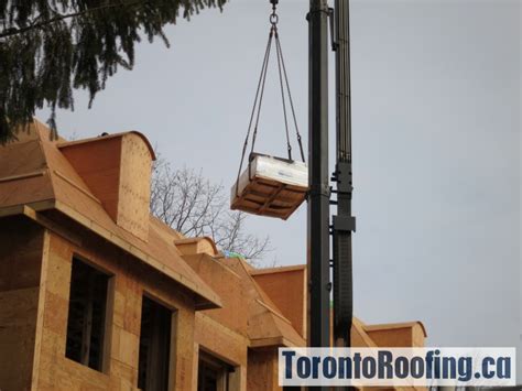 Rooftop Drop Of Flat And Sloped Roofing Material On Custom Home