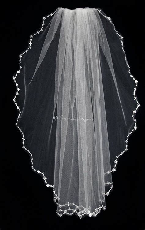 A More Pointed Scalloped Edge Bridal Veil That Is Adorned