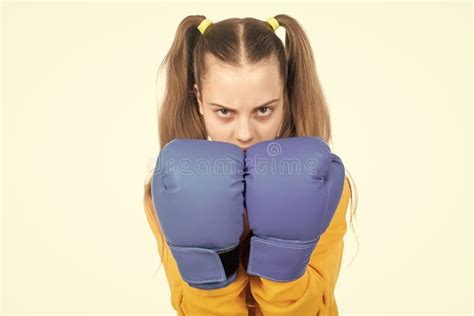 Concentrated Kid Punching Fist To Fight Teen Girl In Boxing Gloves