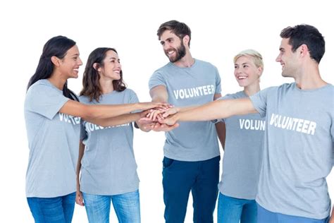 Group Of Volunteers Putting Hands Together Stock Photo By