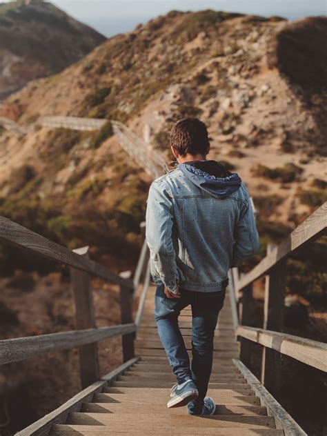 Photo Of Man Going Down Stairs · Free Stock Photo