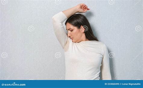 Young Woman With A Sweat Problem Under Armpits The Concept Smells Bad