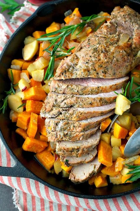 A roasted pork tenderloin meets a mouth watering maple rosemary glaze and it's a match made in heaven. Roasted Pork Tenderloin with Apples - The Seasoned Mom