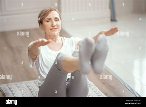 Beautiful Woman Stretches Her Legs And Arms Stock Photo Alamy