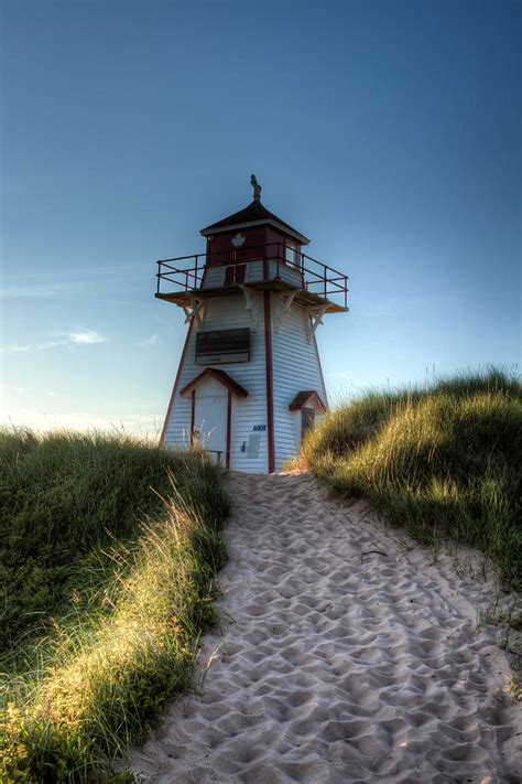 Lighthouse By The Sea Photograph By Matt Dobson