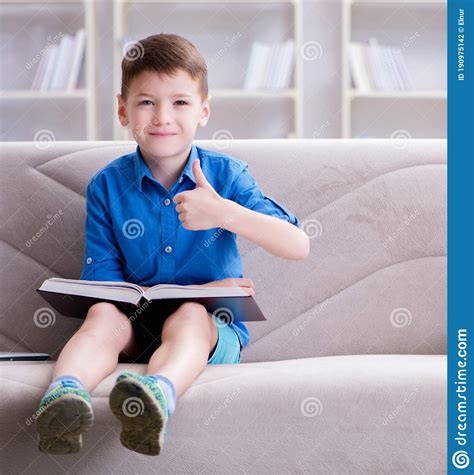 Small Boy Reading Books At Home Stock Photo Image Of Reading