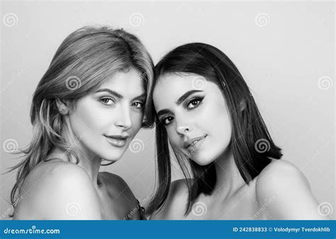 Closeup Portrait Of Young Blonde And Brunette Girls With Clear Skin And Perfect Nude Makeup