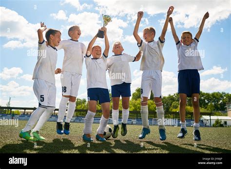 Junior Football Team Celebrating Victory Stock Photo Alamy